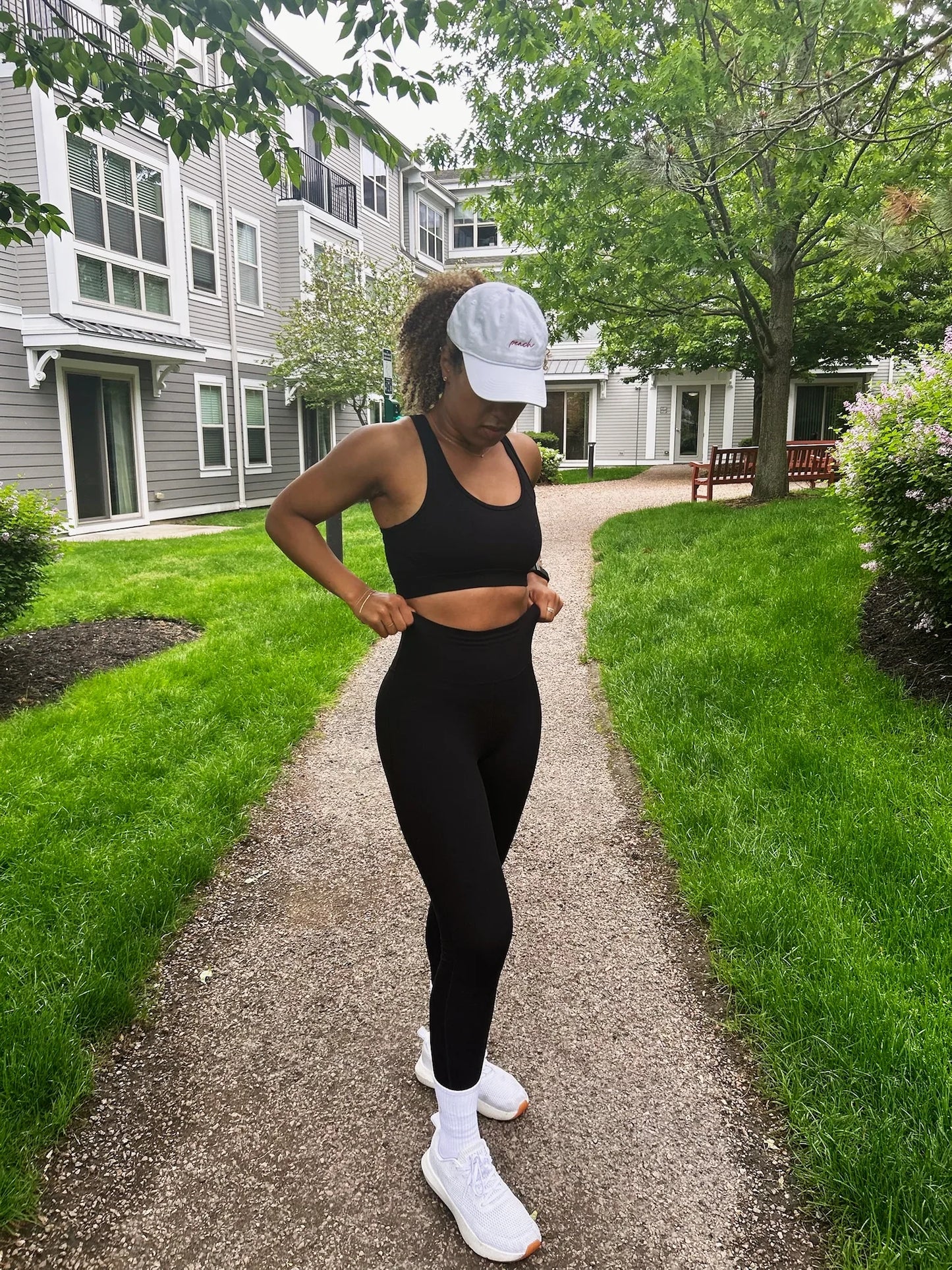 Woman wearing full Signature Set, Everyday Hat, and Classic Crew socks outside