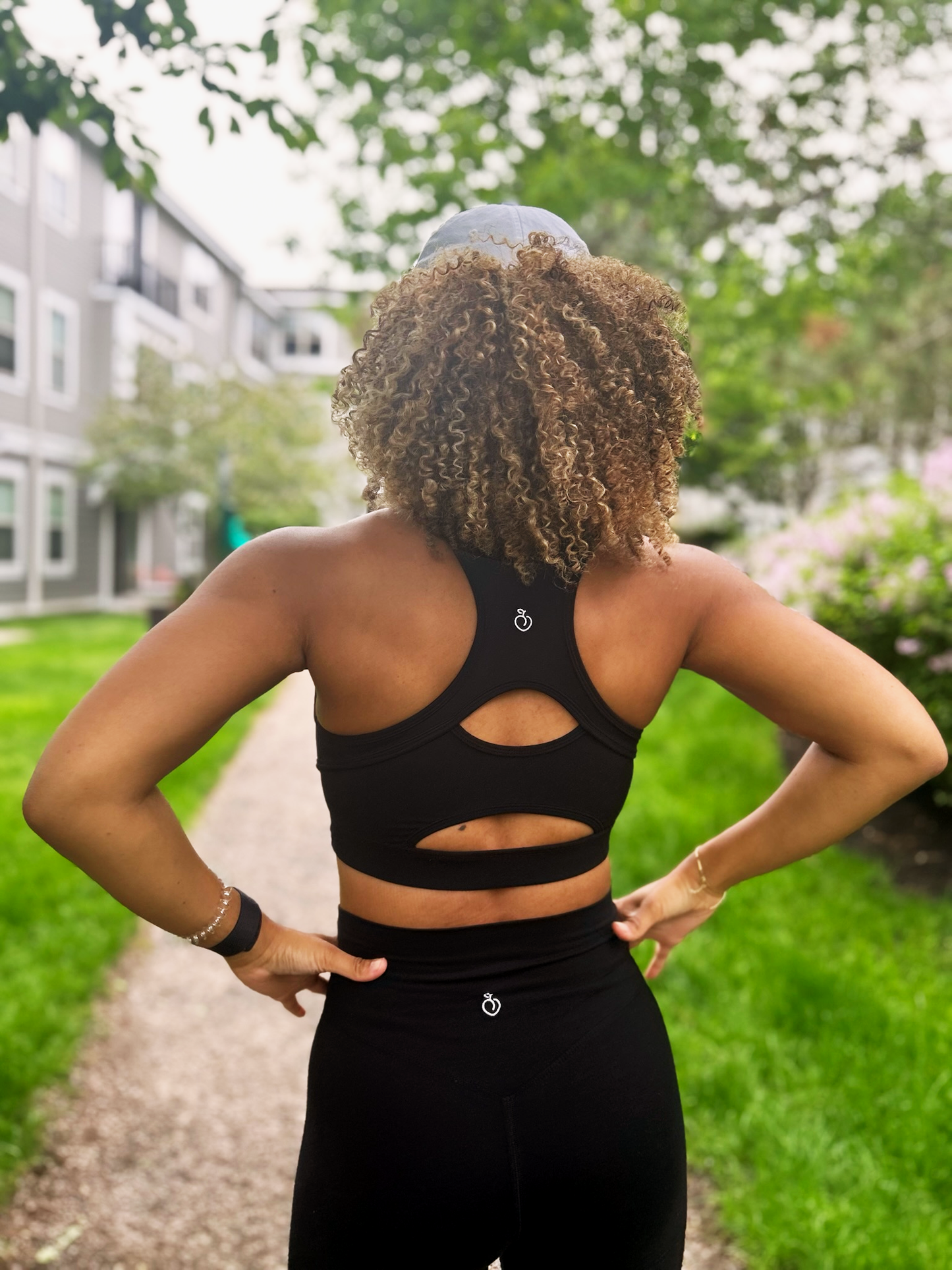 Model wearing black signature sports bra