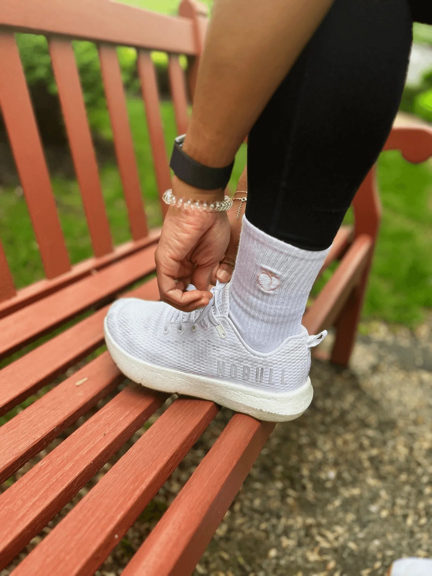 Lifestyle image of foot on bench wearing classic crew sock