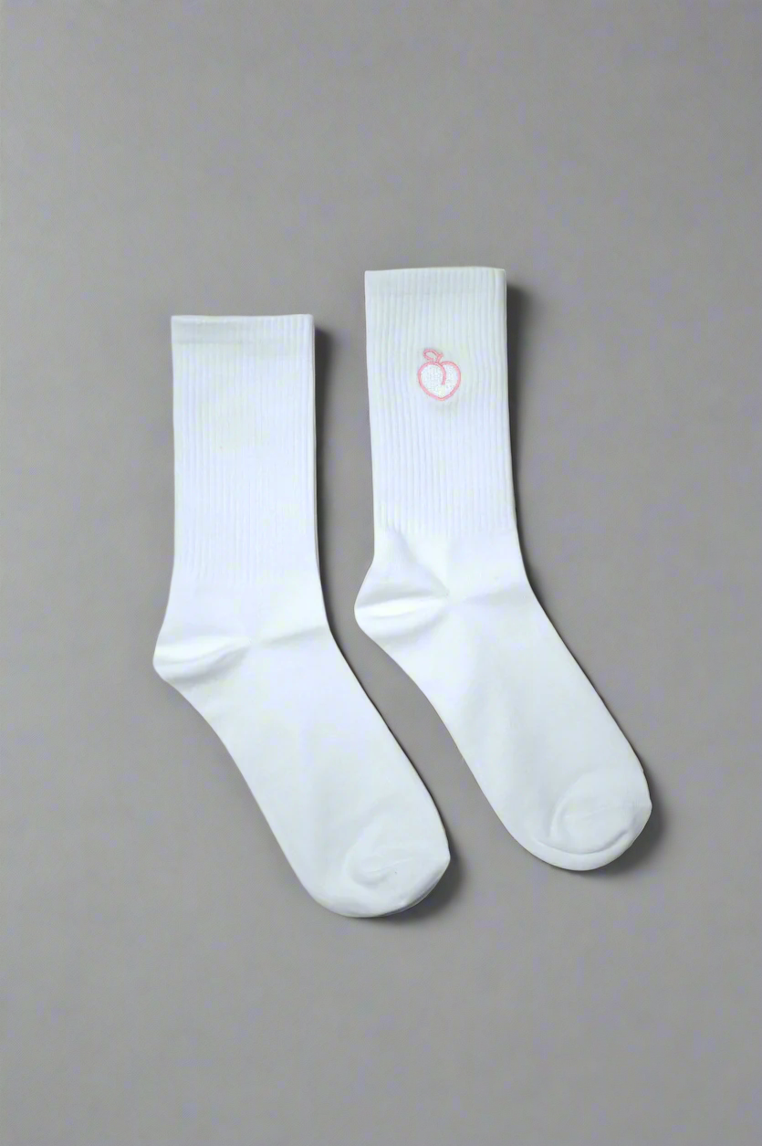 White crew socks with embroidered peach logo