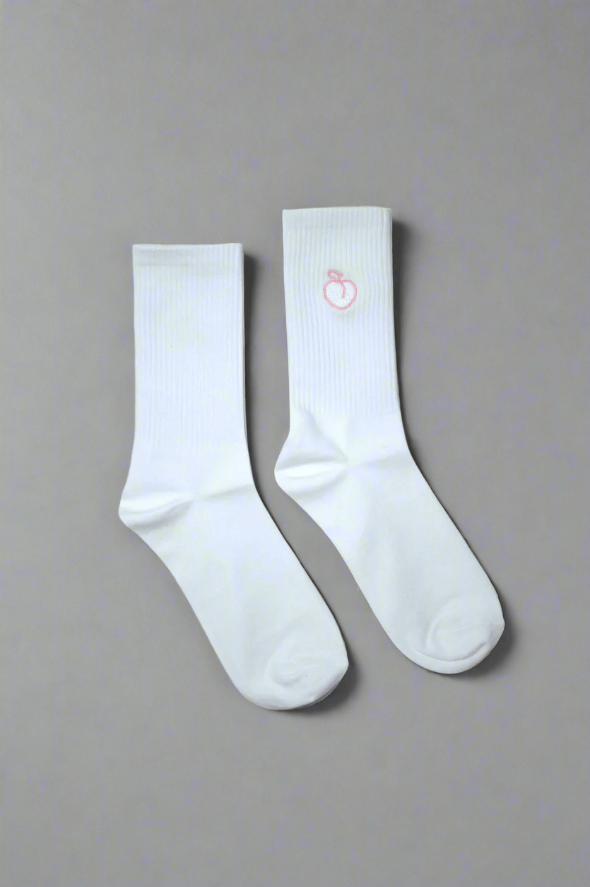 White crew socks with embroidered peach logo