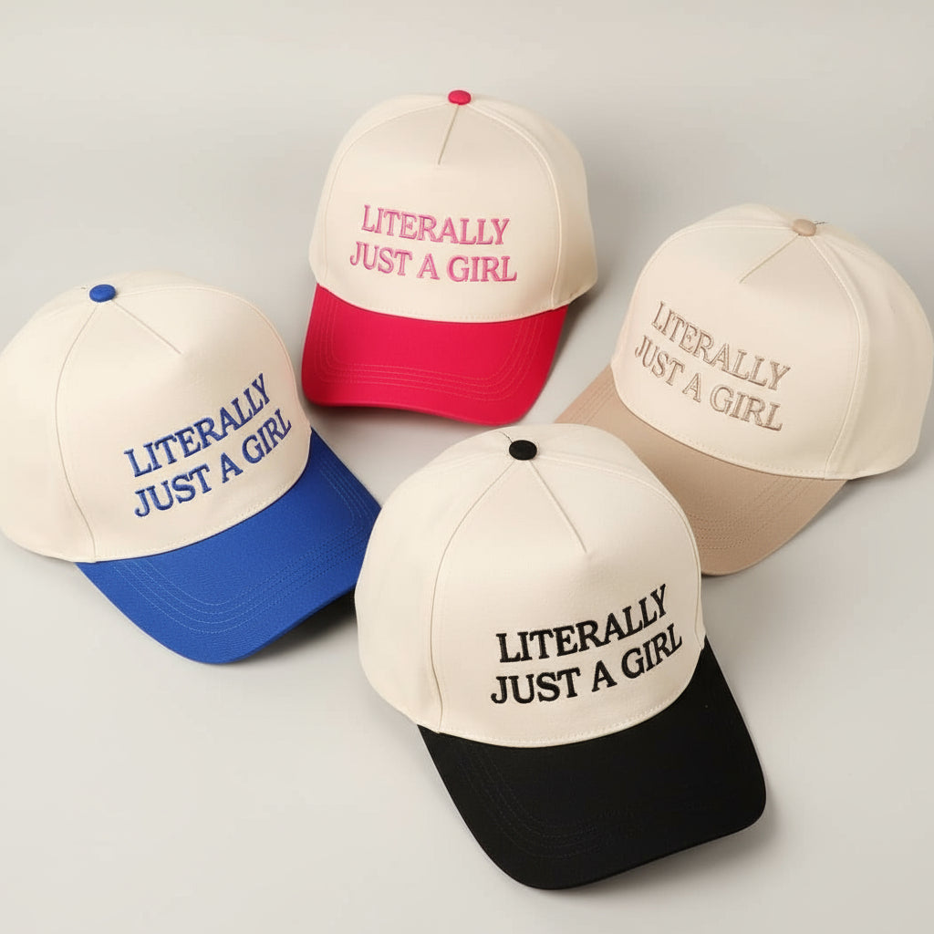 Collection of baseball caps with 'Literally Just a Girl' text in various colors on a light background.
