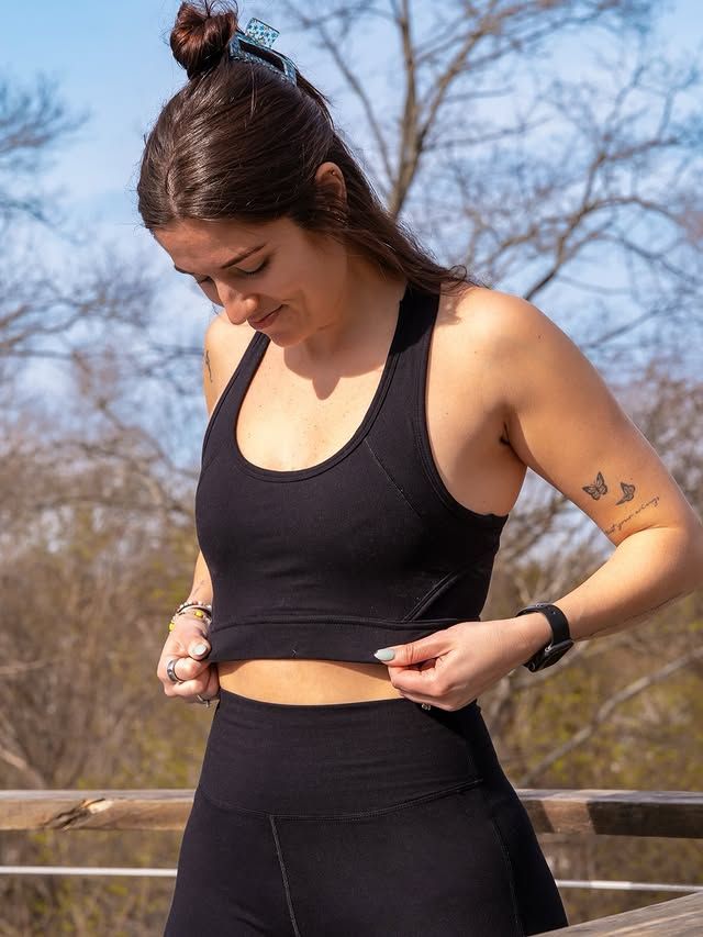 Woman wearing Signature Leggings and showcasing Signature Sports Bra