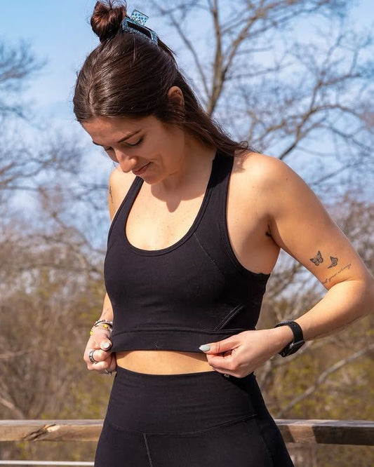 Woman wearing Signature Leggings and showcasing Signature Sports Bra