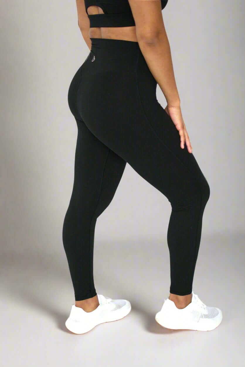 Side view of black high waisted leggings