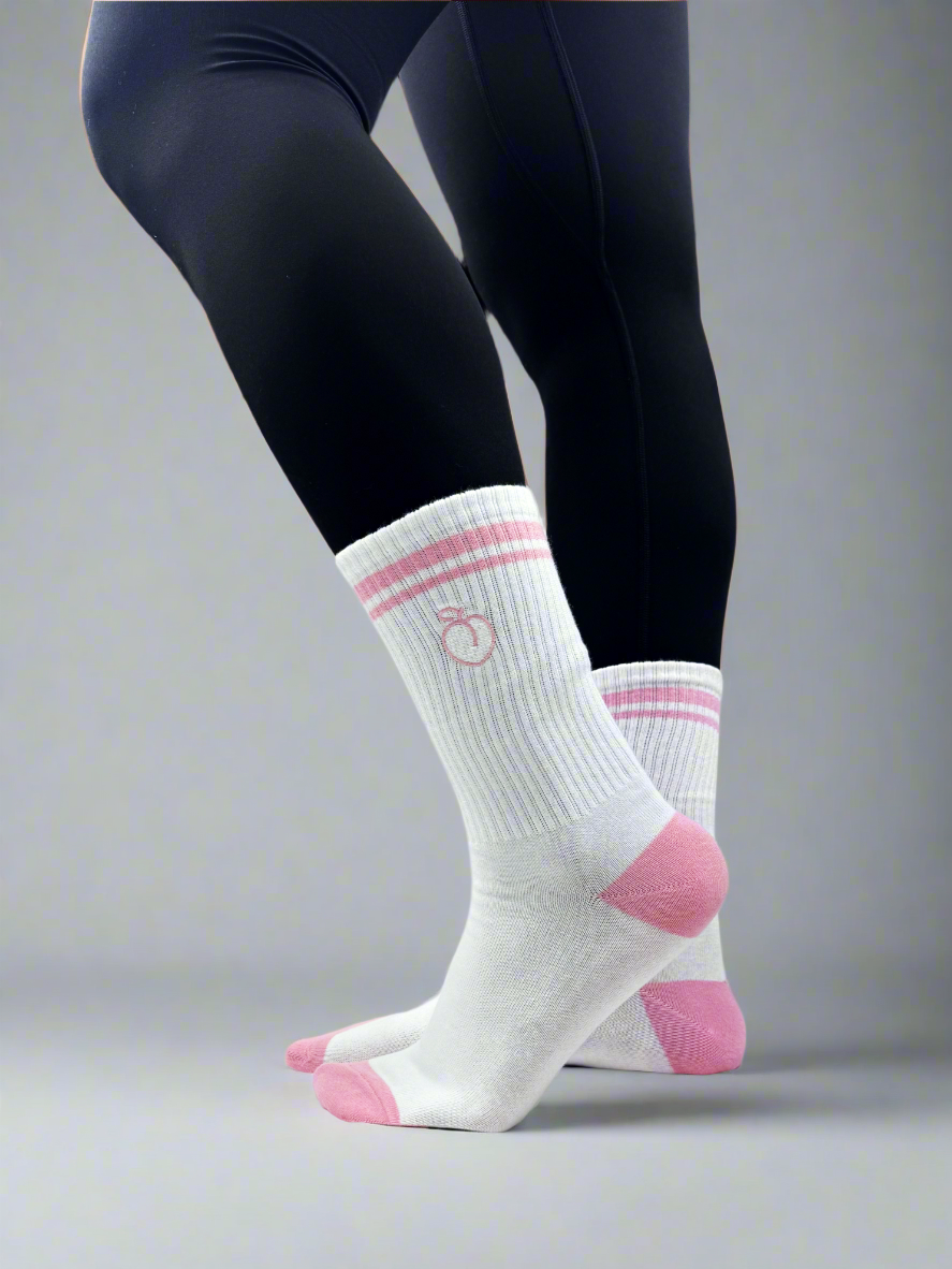 model wearing pink and white striped crew socks