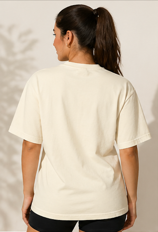 Person wearing a plain white t-shirt against a neutral background