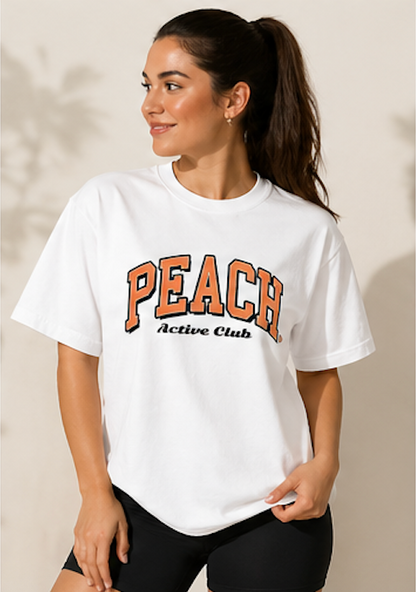 Woman wearing a white t-shirt with 'Peach Active Club' text on a beige background