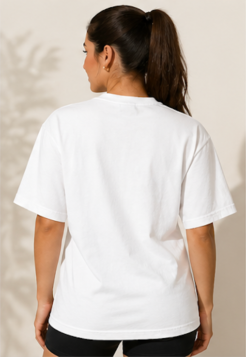 Person wearing a plain white t-shirt against a neutral background